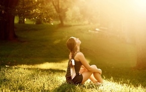 sitting, sunlight, looking up, girl outdoors, grass, braids